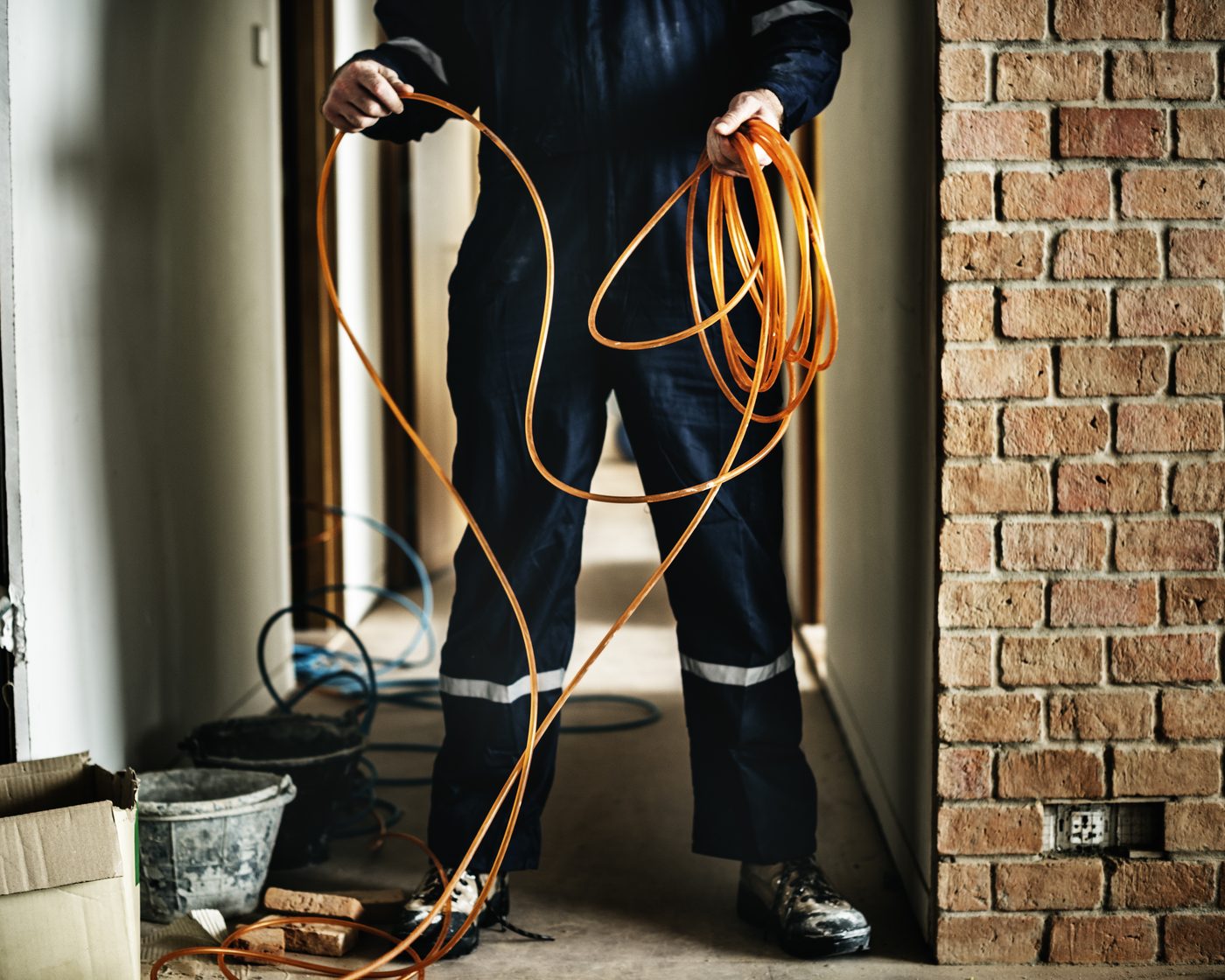 Electrician running new wiring during a home rewire