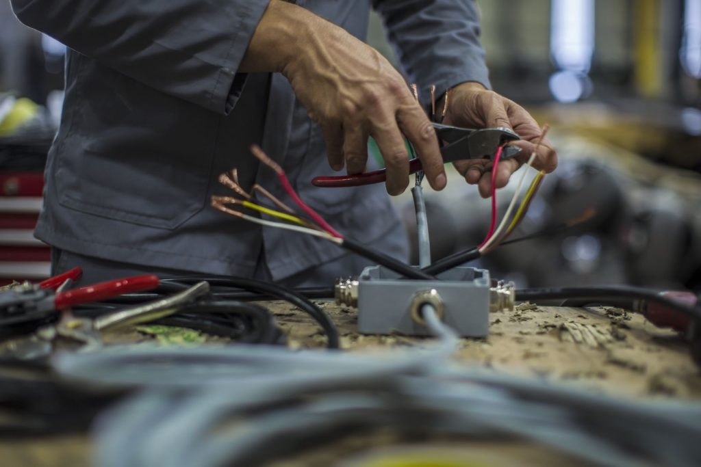Close up of mechanics hands in workshoputc