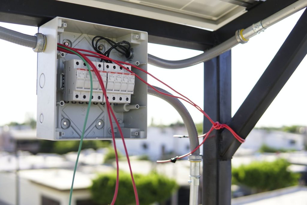 Electrical box with wires on a city rooftoputc
