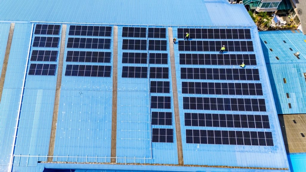 Solar panel installation on a commercial buildingutc