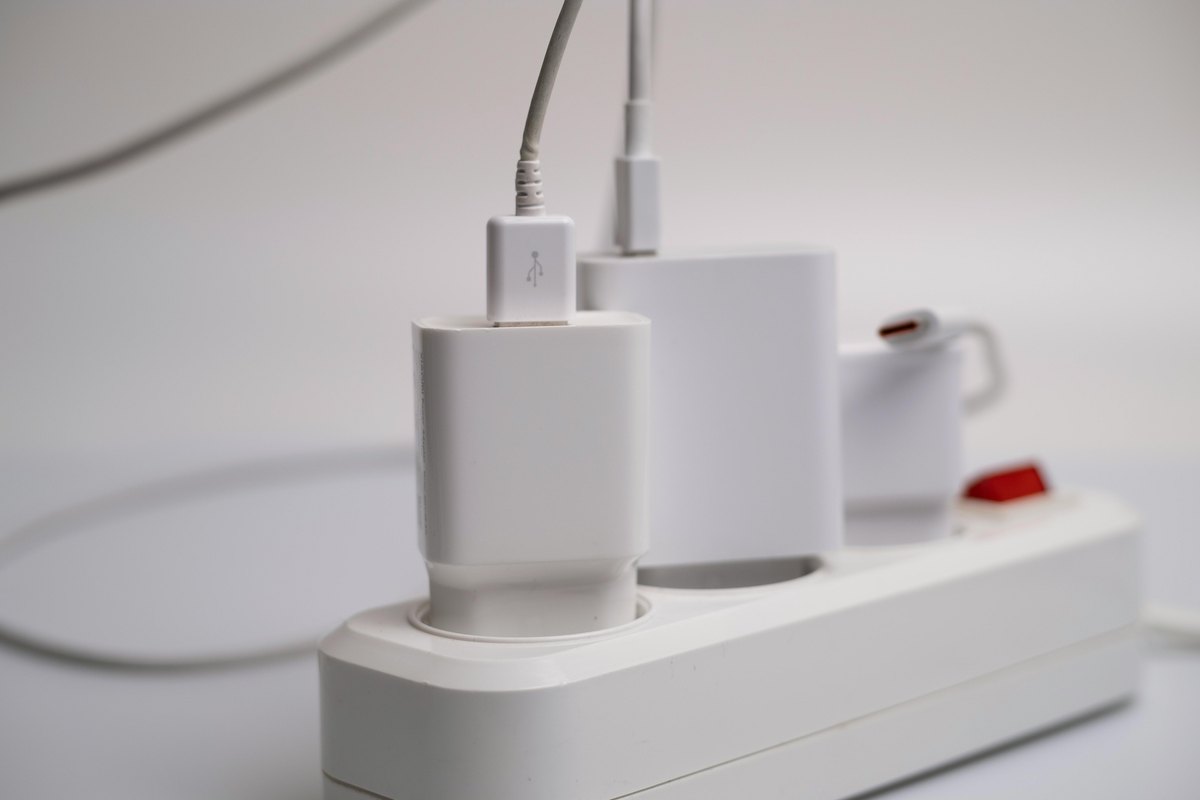 Several chargers and appliances plugged into one power strip