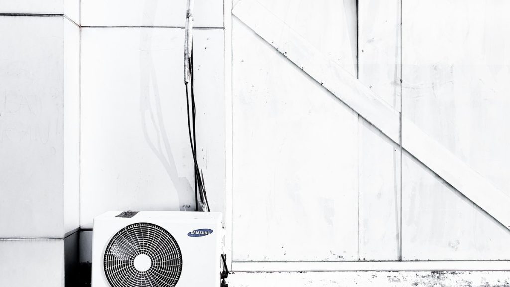 grayscale photography of outdoor AC unit