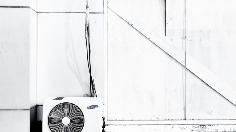 grayscale photography of outdoor AC unit