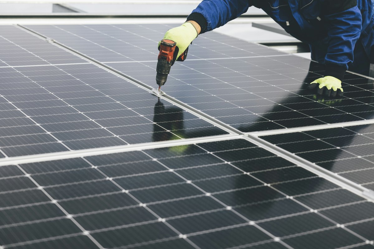 A person working on a solar panel