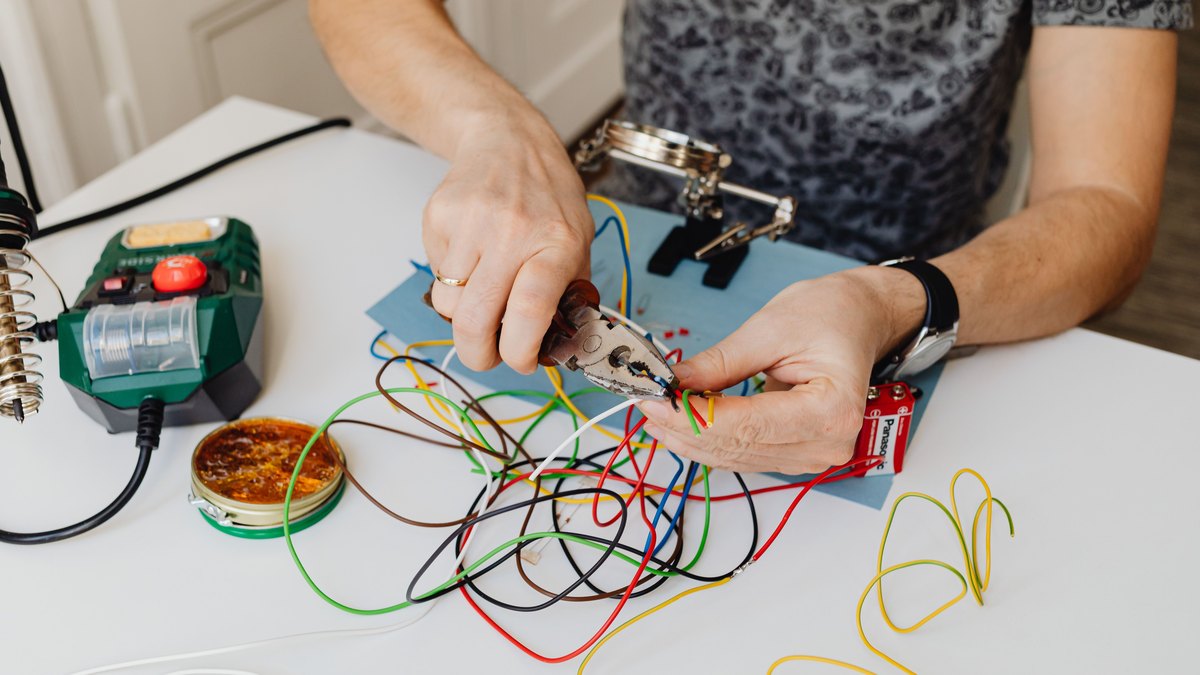 An electrician working on wiring