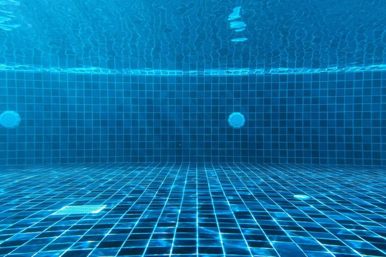 blue swimming pool with water