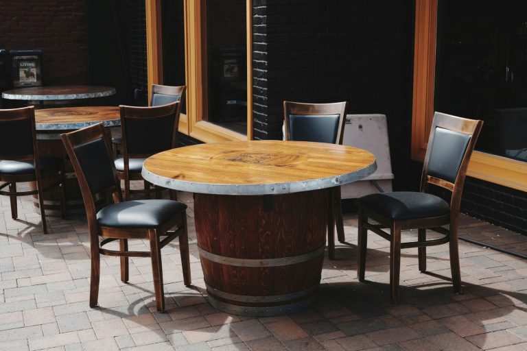 Outdoor dining tables and chairs on brick patio