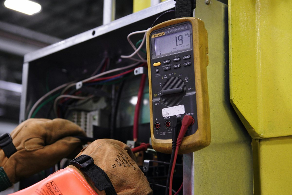 An electrician working on a home's wiring