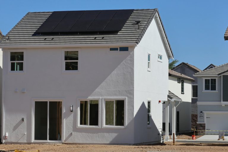 Newly constructed eco-friendly home in Elk Grove, CA, featuring rooftop solar panels for sustainable energy.