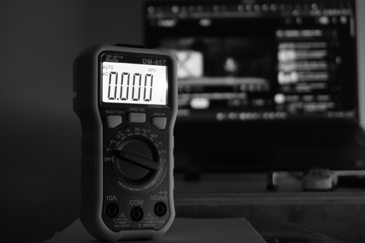 An electrician testing an electrical system with a multimeter