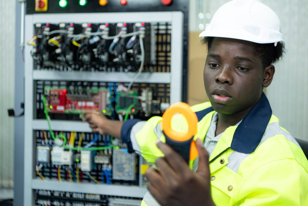 Testing voltage at an outlet with a multimeter